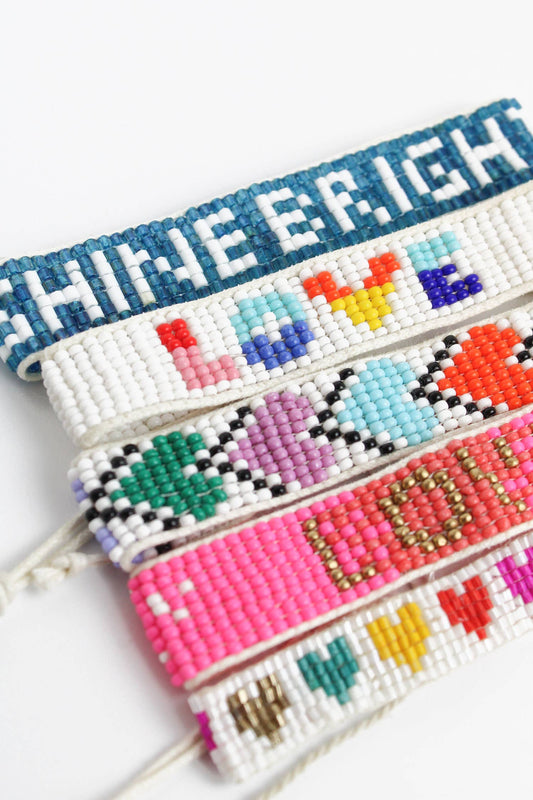 SET MIT 5 WEISSEN REGENBOGEN-ARMBÄNDERN